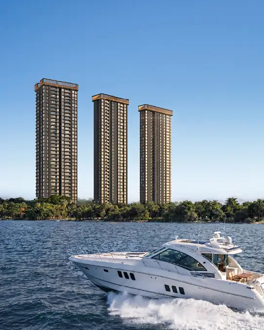 Yacht on the water with the Ocean Cliffs towers behind